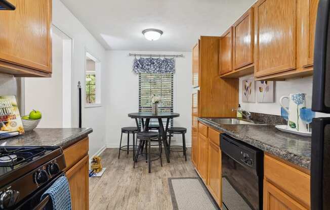 spacious kitchen with dining area at The Berkshires at Vinings apartments