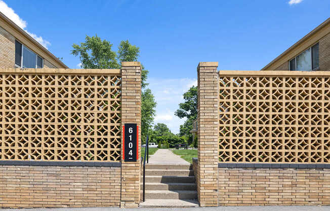 Mid-century modern entry wall and address marker at 6104 E 61st Street, entrance to Monon Court apartments in Broad Ripple