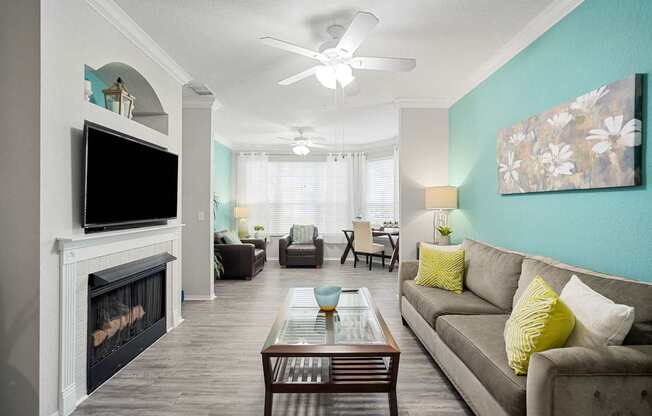 A living room with a fireplace and a couch.