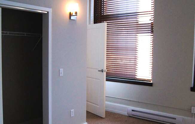 an empty room with a window and a door at Residences at South High, Pittsburgh, PA 15203 ? 