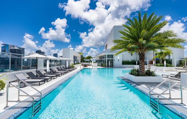 Dive into resort-style living at Modera Riverside’s rooftop pool surrounded by stunning Miami views.