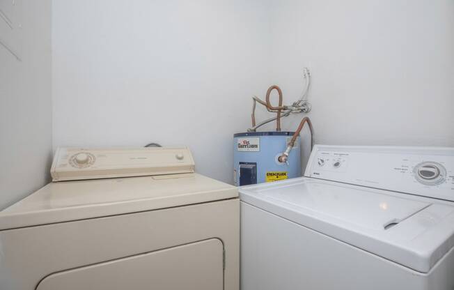 a laundry room with a washer and dryer