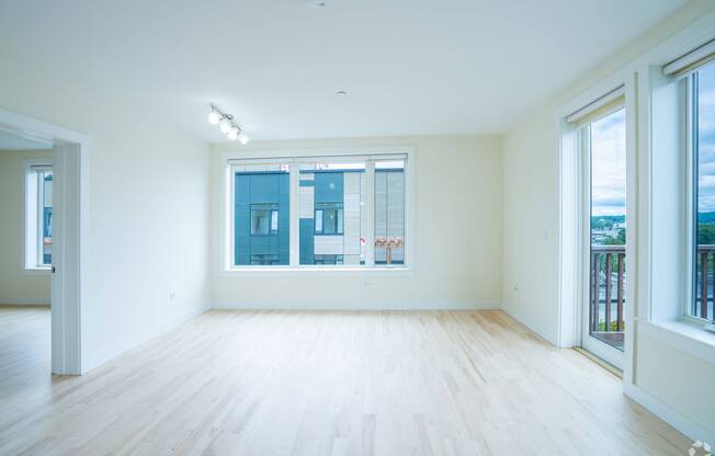 A large empty room with a window overlooking a cityscape. at 603 Concord Apartments, Cambridge 02138