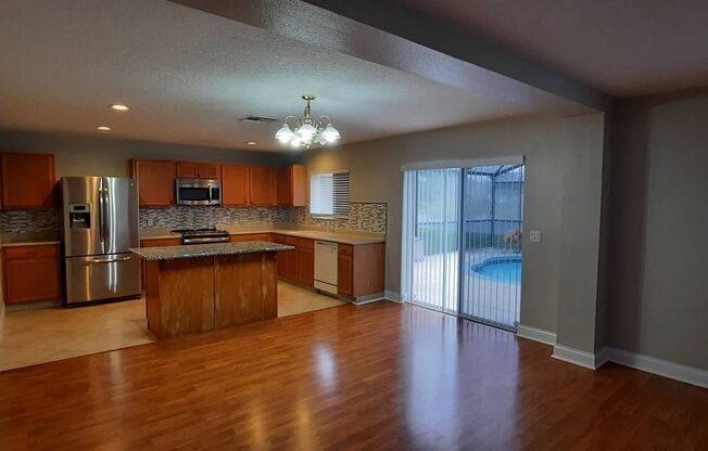 Gorgeous waterfront 4 beds 2 and half baths  home in highly desirable Eagle Creek Community in the heart of Lake Nona.