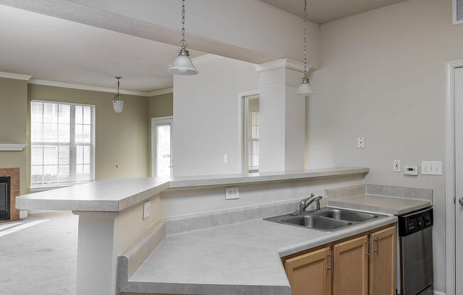a kitchen with a sink and a mirror