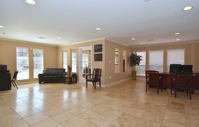 a large living room with a large tile floor