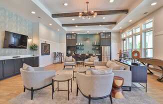 A modern living room with a grey sofa set and a wooden coffee table.