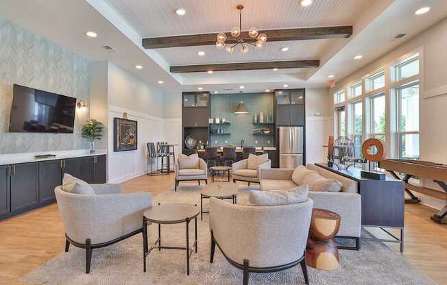 A modern living room with a grey sofa set and a wooden coffee table.
