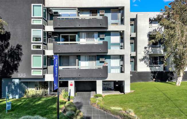 A modern building with a blue sign that reads "Central Park".