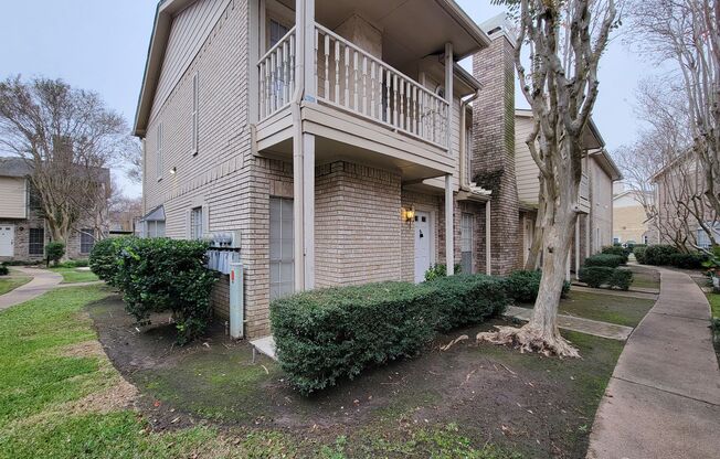 Beautiful two-story corner unit filled with natural light!