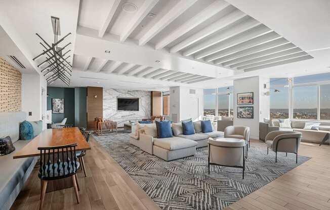 A modern living room with a wooden floor and a large window.