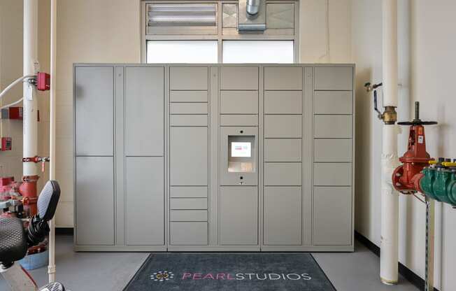 a row of lockers with a rug in front of them