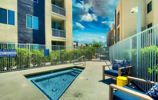 A pool with a sign that says "No Diving Shallow Water".