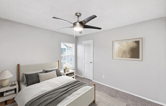 Model Bedroom with Carpet and Window View at Vue at Baymeadows Apartments in Jacksonville, FL.