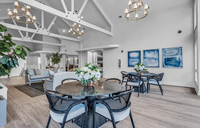 a dining room with a table and chairs