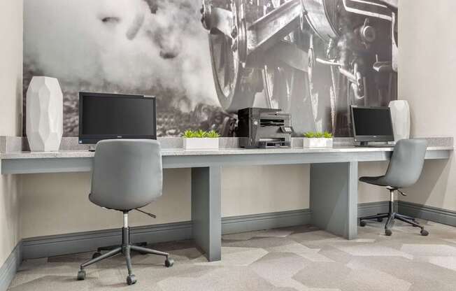 A modern office with a large poster on the wall.