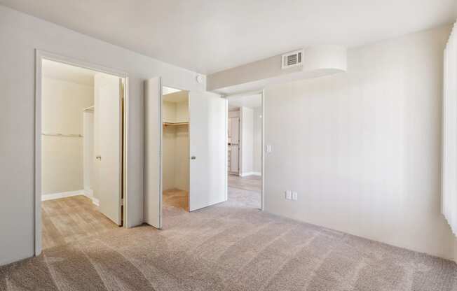 Bedroom and Walk-in Closetat Copper Ridge Apartments in Kingman Arizona