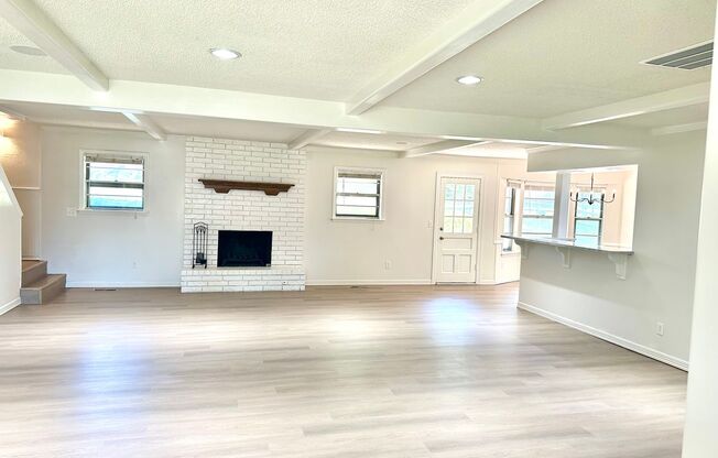 Completely Remodeled 3 Bed 2 Bath Home with 3 car garage and large back yard on the golf course.