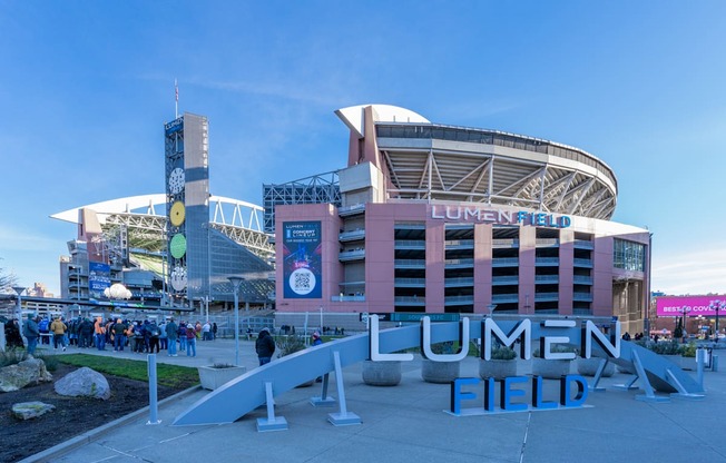 a view of the front financial field in front of a large stadium