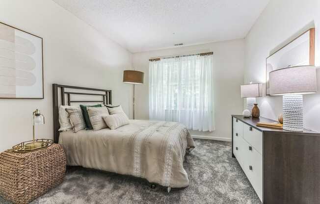 the preserve at ballantyne commons apartments bedroom with bed and dresser