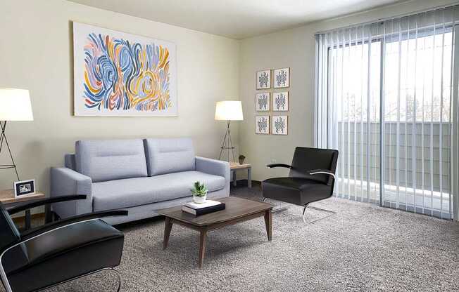 a living room with a white couch and a coffee table at Shiloh Glen, Billings, MT