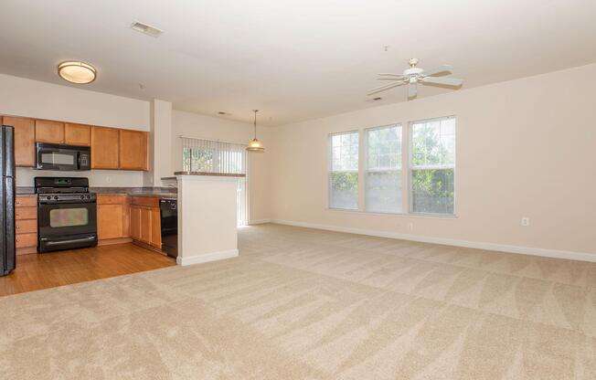 a living room filled with furniture and a flat screen tv