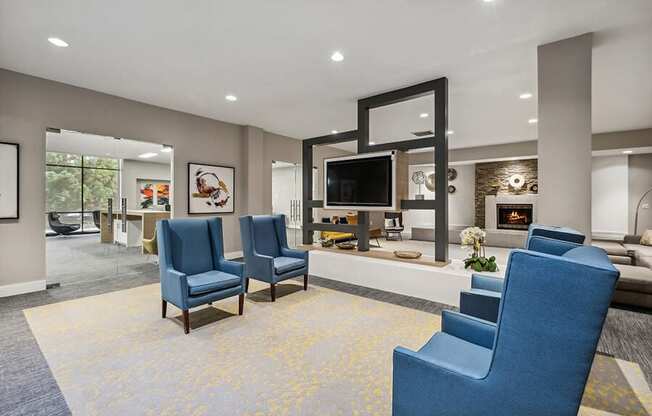 Community Clubhouse with Lounge Furniture, TV & Fireplace at Mason Van Dorn Apartments located in Alexandria, VA.
