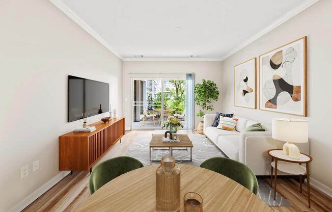 Bright living area with dedicated dining space, private patio access, and an open layout that brings natural light throughout the home.