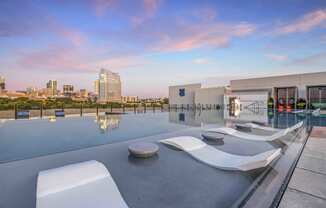 Rooftop Infinity Pool with Outdoor Lounge and Cabanas