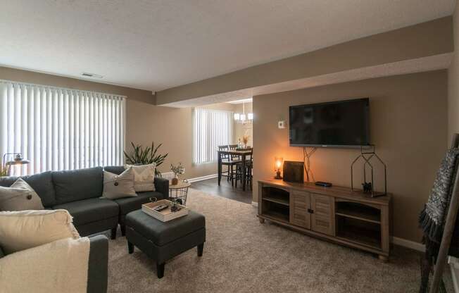 This is a photo of the living room in the upgraded 650 square foot, 1 bedroom, 1 bath model apartment at Deer Hill Apartments in Cincinnati, Ohio.