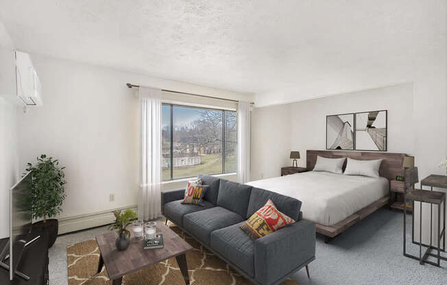 studio living areas with large window at Seville Apartments in Kalamazoo, MI 49009