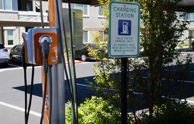 Electric car charging station in parking lot