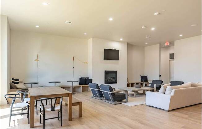 A modern living room with a fireplace and a television at Northplace Apartment Homes, Salem, 97305