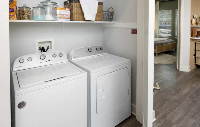 the washer and dryer in the laundry room of a home