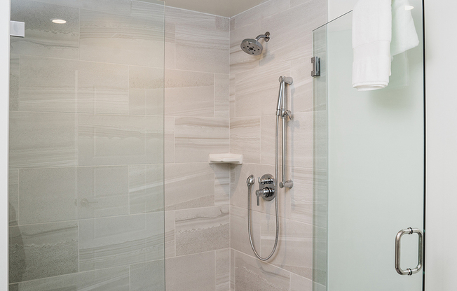 Oversized showers with floor to ceiling tile