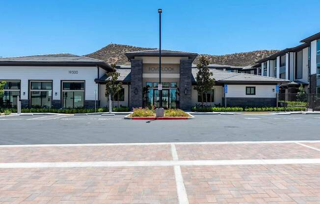 A building with the number 19500 on it is surrounded by a parking lot.