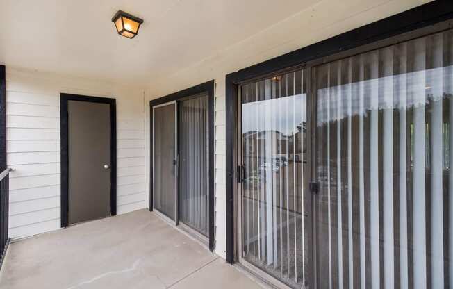 Patio with sliding glass doors at The Glen at Highpoint, Dallas, TX, 75243