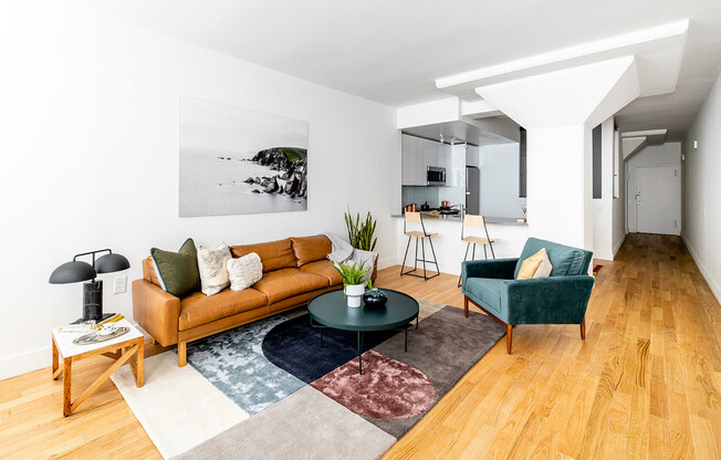 Open concept living and dining space with hardwood floors in historic building in Upper East Side