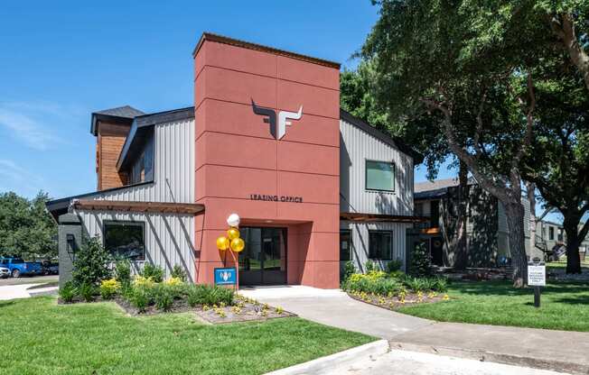 fusion fort worth apartments leasing office in Haltom City, Texas with green lawn and modern logo