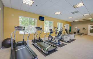 a room filled with lots of exercise equipment