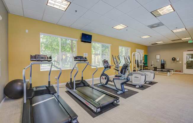 a room filled with lots of exercise equipment