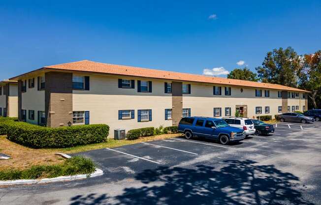 A building with a parking lot in front of it.