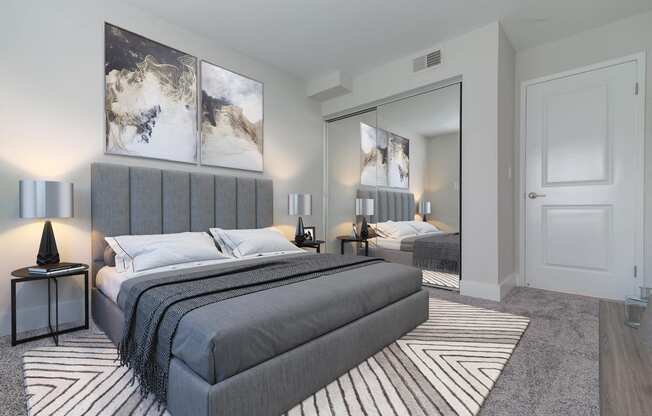 a bedroom with a bed and a mirror  at Laguna Gardens Apts., Laguna Niguel