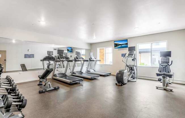 the gym with treadmills and other exercise equipment at the belgard apartments at Parks Residential - Denver, Centennial, 80111