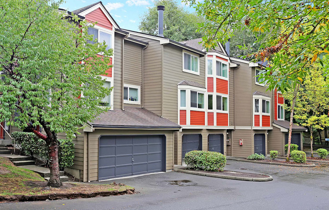 the view of a apartment building with a garage door