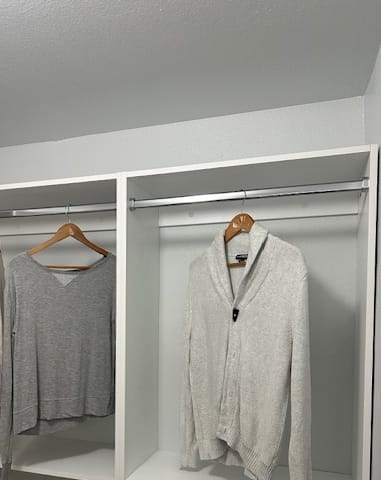 a shelf with towels in a closet