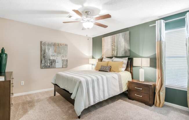 bedroom with ceiling fan at Avalon Apartment Homes in Starkville, MS