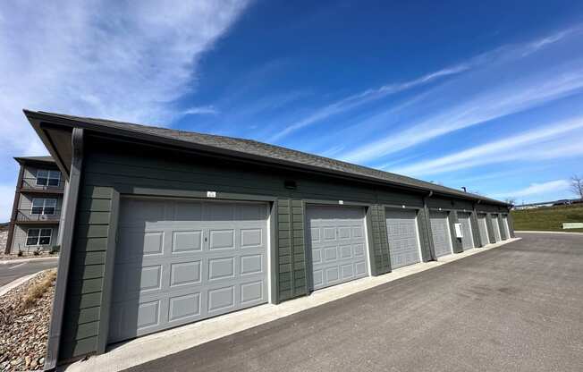 a garage with a row of garage doors and a blue sky at The Depot, Missouri