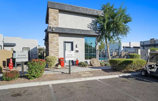 A building with a sign that says "Future Residents" in front of it.