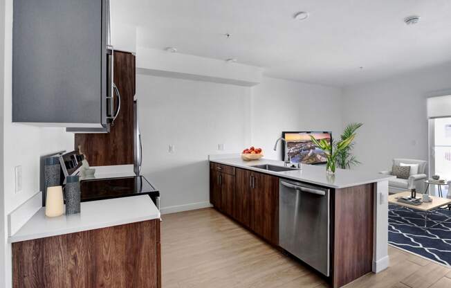 a kitchen with a large island and a stainless steel dishwasher